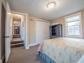 The North Bedroom has a queen bed and spacious wardrobe closet.