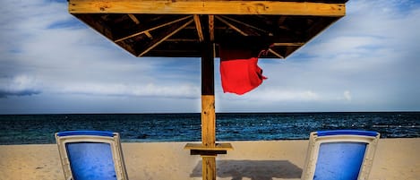 On the beach, sun-loungers, beach towels