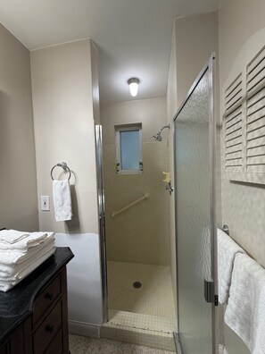 Shower, hair dryer, towels, soap