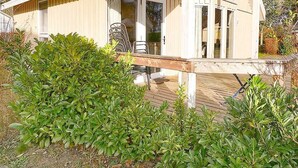 A modern house with a sloped roof, large windows, and a chimney. - Seerose incl. additional costs at Ferienpark Scharmützelsee - Ferienpark (Wendisch Rietz)