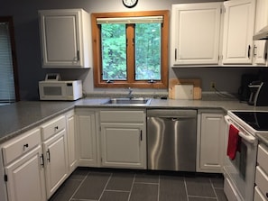 kitchen - Renovated kitchen cabinets, new tile floor, counter, appliances - Renovated Townhouse at Peaceful Suntec, Shuttle to Mount Snow. Hot Tub! (West Dover)