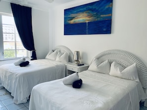 1 bedroom, desk, iron/ironing board, travel crib