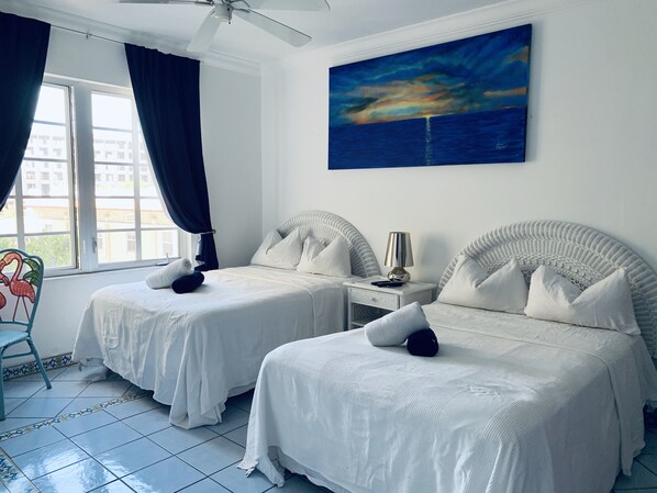 1 bedroom, desk, iron/ironing board, travel crib