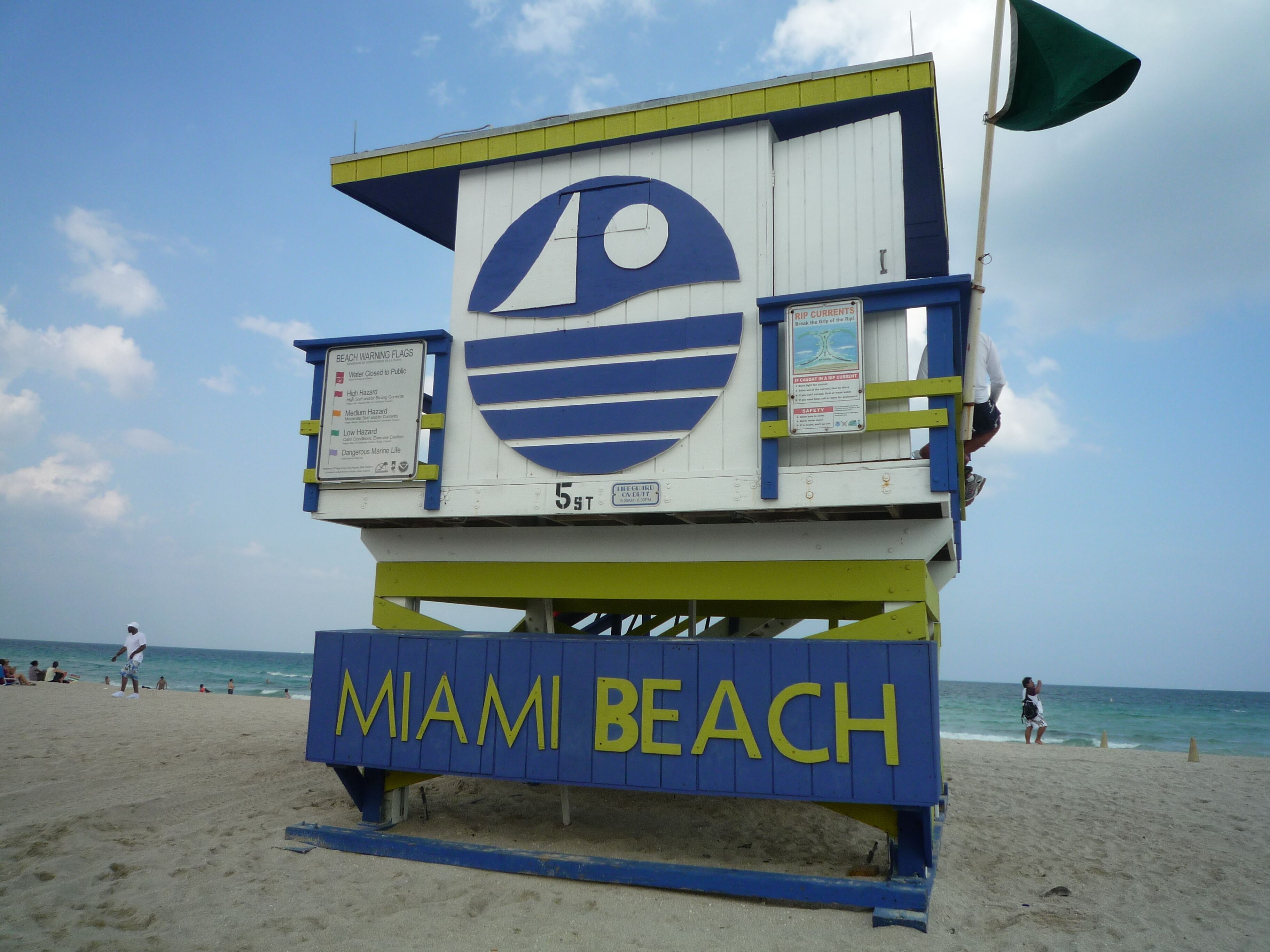 A lifeguard tower with the words "MIAMI BEACH" on it.