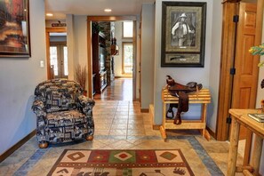 Experience the great outdoors in this cozy hallway, featuring a unique blend of wildlife-inspired decor and rustic charm.