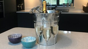 A kitchen counter with a champagne bottle, glasses, and decorative bowls. - Luxury Holiday Home with Hot Tub,  Pet & Family friendly in the Yorkshire Dales  (Eastby)