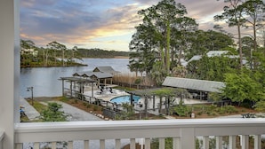 A lakeside resort with a pool, outdoor seating, and a gazebo. - 'More Grayter' * Lake Views *  Walk To Beach * Gorgeous 5 BR Grayton Beach home * Neighborhood pool (Santa Rosa Beach)