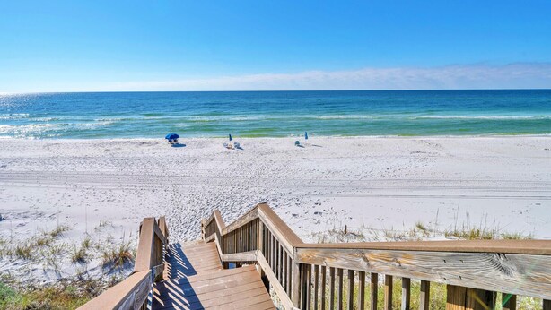 A wooden boardwalk leading to a beach with a clear view of the ocean. - Palms A1: Best Prices to Be Ground Level Directly  on the Beach  (Santa Rosa Beach)