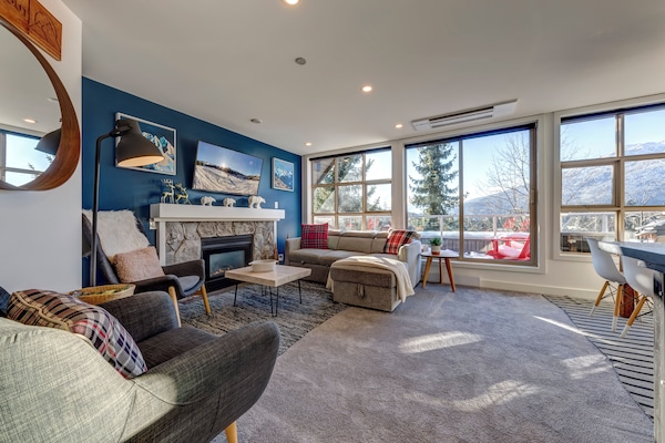 The living room couch stores the bedding and converts to sleeping for 2 guests.