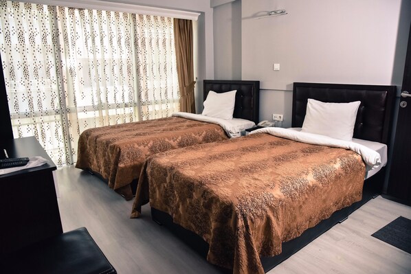 Desk, blackout curtains, free WiFi, bed sheets