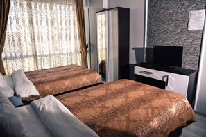 Desk, blackout curtains, free WiFi, bed sheets