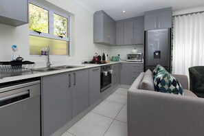 Garden Villa | Private kitchen | Espresso maker, coffee/tea maker, electric kettle, highchair