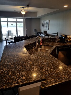 Enjoy meals in this kitchen with a dining area overlooking the outdoors.