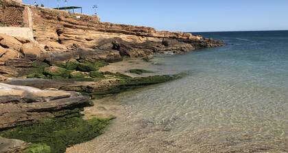 Cozy Apartment with Stunning Sea Views, One Minute Walk from the Beach