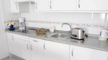 Fridge, microwave, coffee/tea maker, toaster