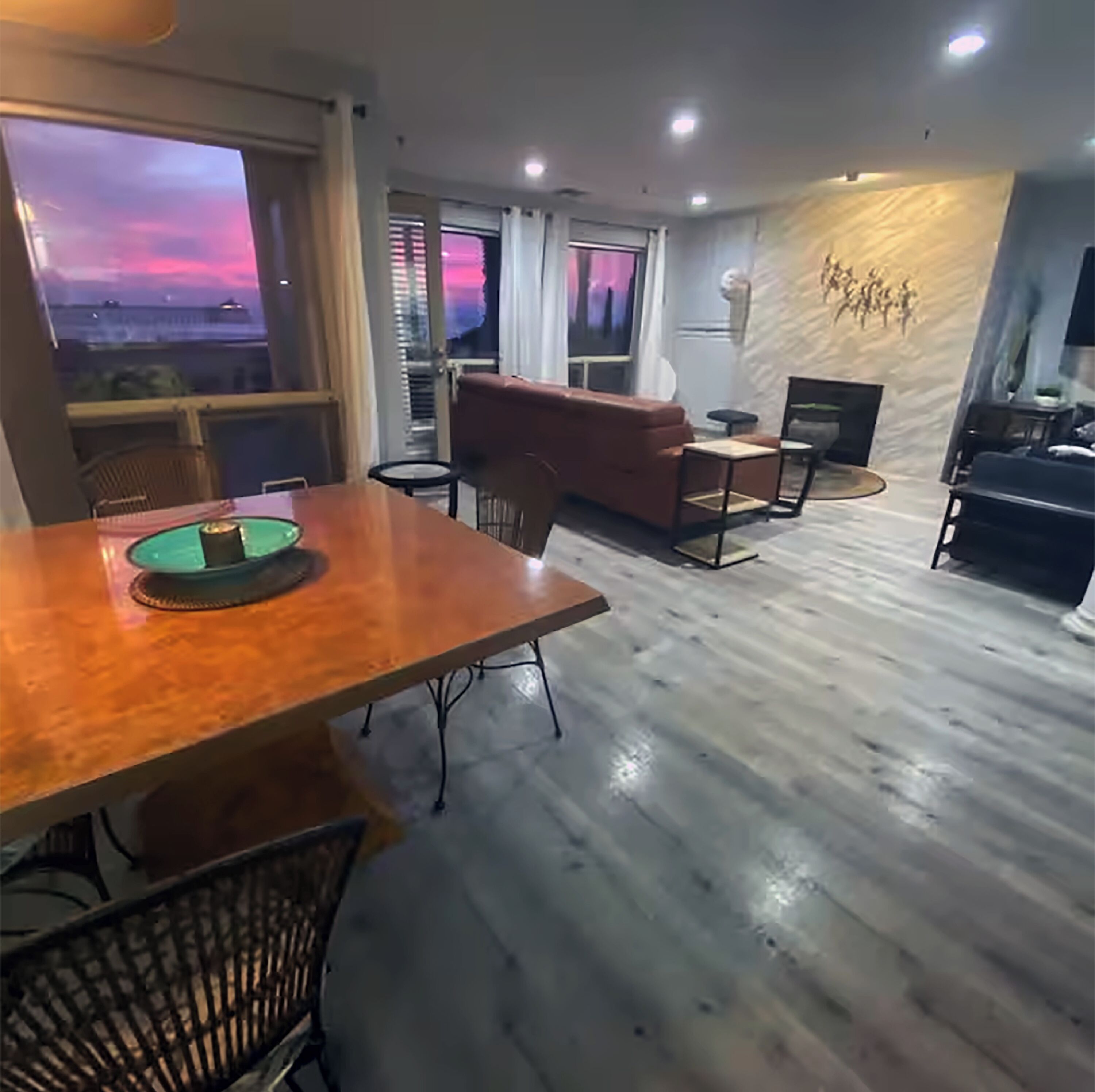 Dine, relax, & soak in sunset hues from your stylish, open-concept living space.