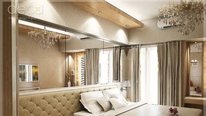 A modern bedroom with a large bed, a mirror, a chandelier, and a window with curtains. - Cosmy Orchard Apartment (Surabaya)