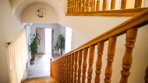 A staircase with wooden balusters leading to an upper floor. - Alba Hotel Yerevan (Yerevan)