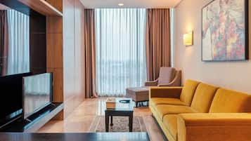 Suite, 1 Bedroom | Living area | Flat-screen TV