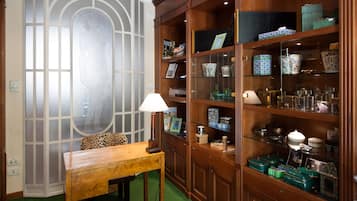 Classic bookcase and desk create a comfortable workspace with a touch of elegance.