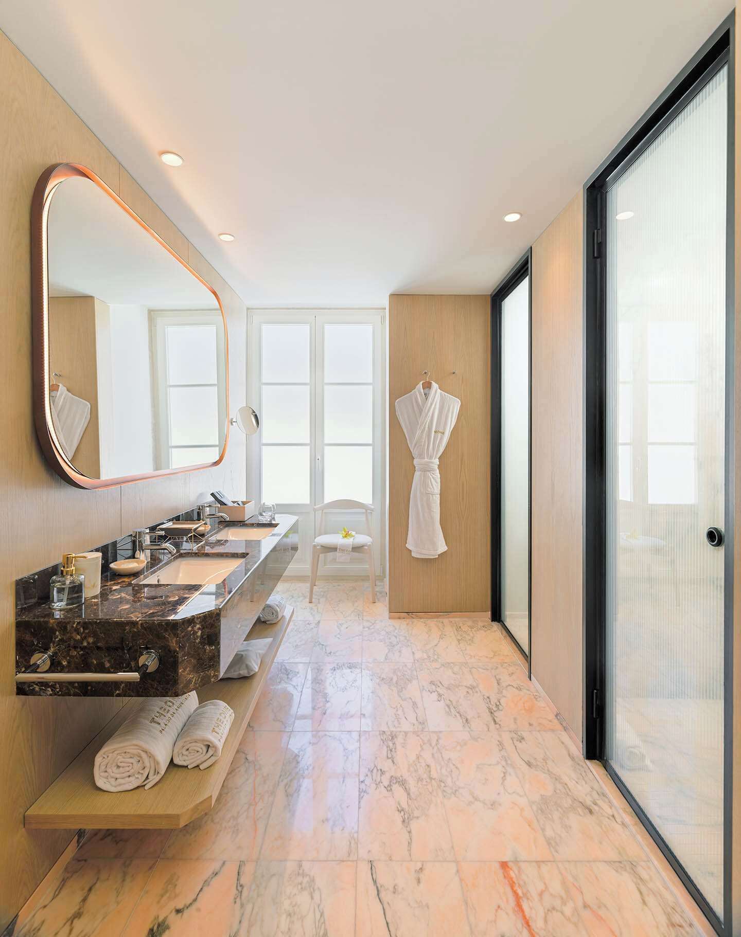 deluxe room (grand) | bathroom | designer toiletries, hair dryer, bathrobes, slippers