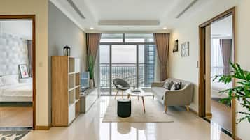 Deluxe Apartment, 3 Bedrooms | Living area | Smart TV