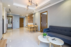 Deluxe Apartment, 3 Bedrooms | Living area | Smart TV - Zahoo House - Vinhomes Central Park (Ho Chi Minh City)