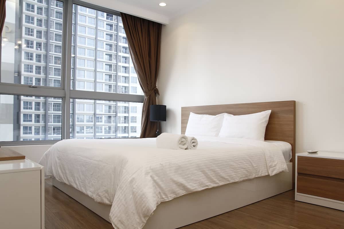 Premium bedding, desk, laptop workspace, blackout curtains