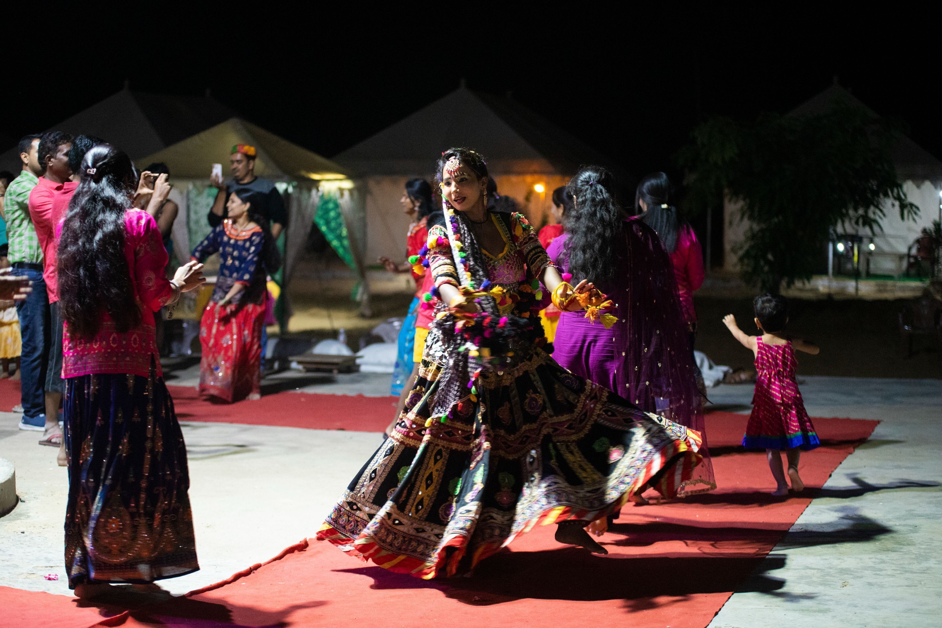 A group of people in traditional attire, possibly at a cultural event or celebration.