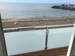 On the beach, black sand, beach towels - Beach House by Azores Villas (Ponta Delgada)