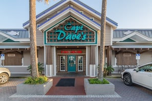 A building with a sign reading "Capt Dave's Fish House" and a wheelchair accessibility sign.