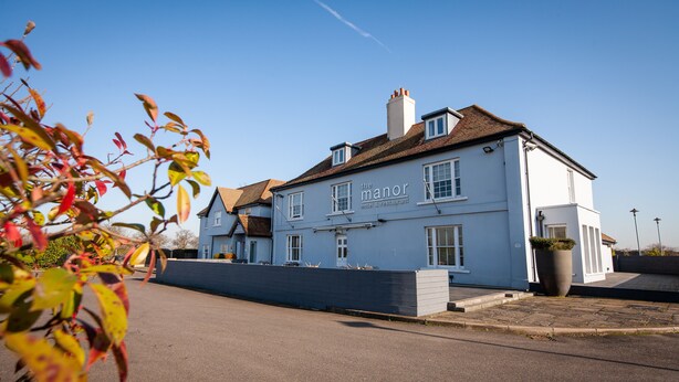 A two-story building with a sign reading "The Manor Hotel & Restaurant." - Berwick Manor Hotel (Rainham)