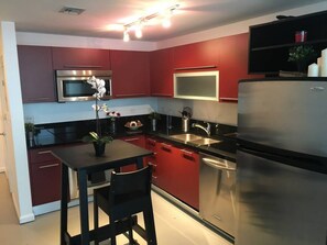 Apartment, 1 Queen Bed with Sofa bed, Non Smoking | Private kitchen | Full-size fridge, microwave, oven, stovetop
