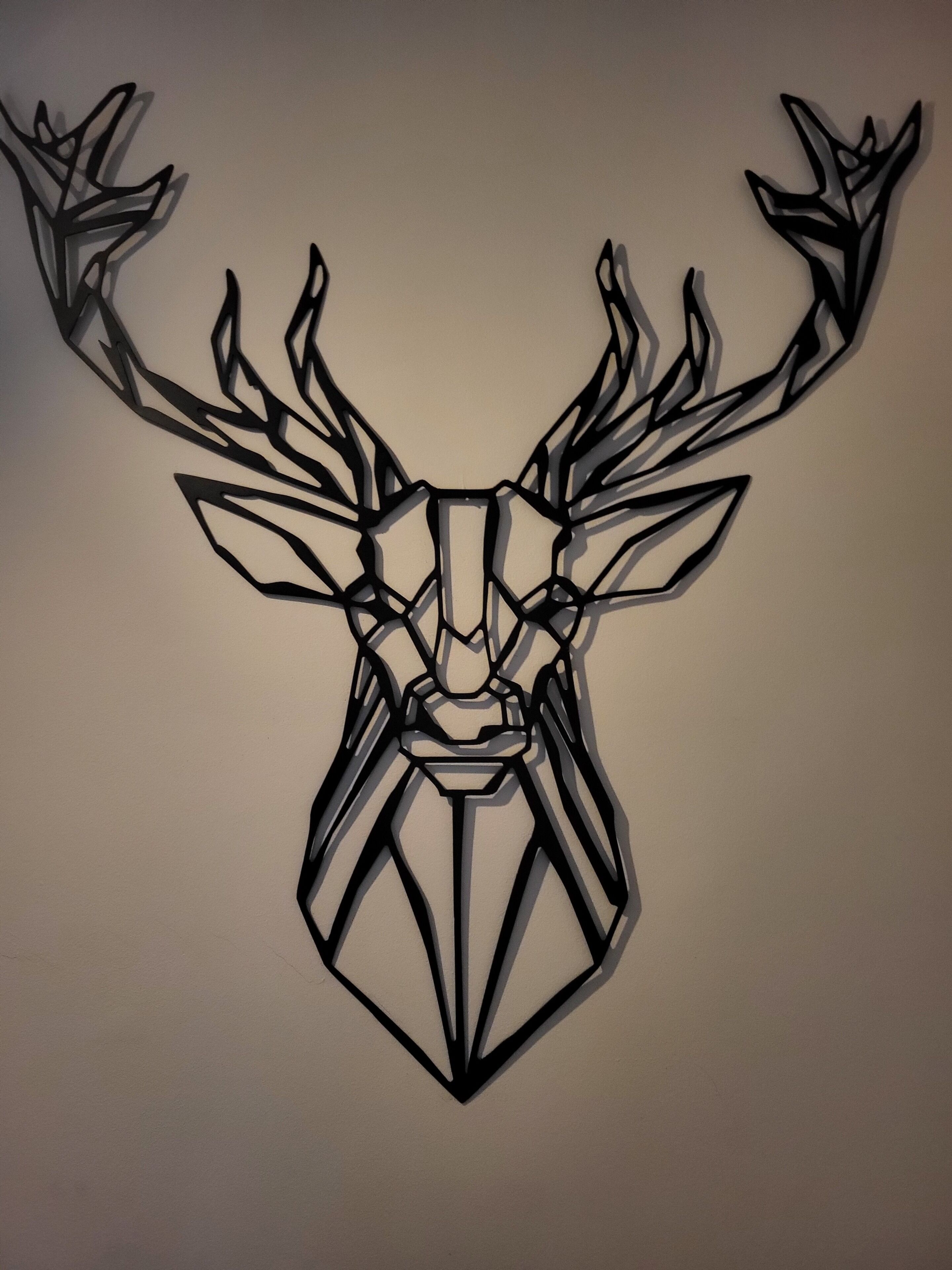 A geometric wall art of a deer head.