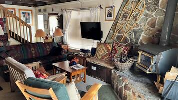 Smart TV, fireplace, DVD player, books