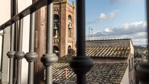 A view of a bell tower through a window with a metal railing. - Apartment/ flat - Palaia (Palaia)