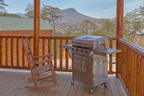 Relax on the deck with a mountain view, where you can grill and unwind in a peaceful outdoor space.