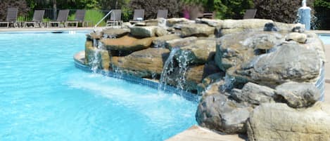 Seasonal outdoor pool, open 9:00 AM to 10 PM, pool umbrellas