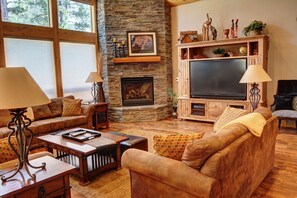 Safari-themed Great Room w/vaulted ceiling, fireplace, 65" TV & surround sound