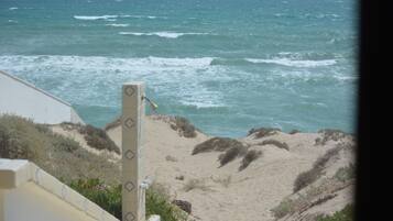 On the beach, sun loungers, beach towels