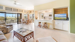 Relax in the living area with a comfortable sofa and dining table, or step out onto the balcony for a scenic view.