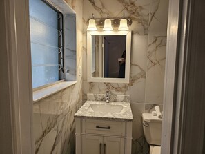 Combined shower/bathtub, hair dryer, towels, soap - Cozy Duplex overlooks the water and is within walking distance of the beach! (Lauderdale-By-The-Sea)