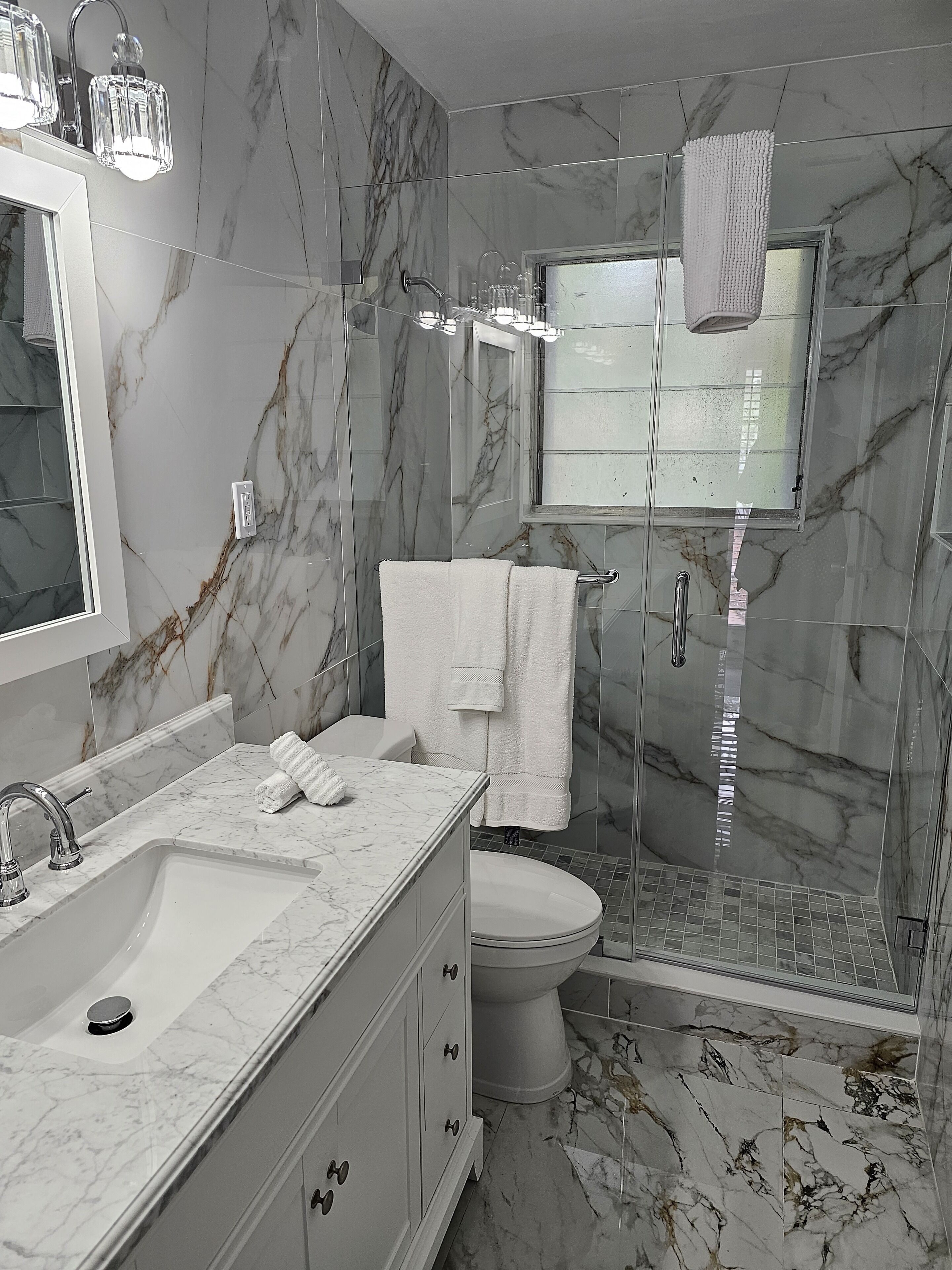 Combined shower/tub, hair dryer, towels, soap