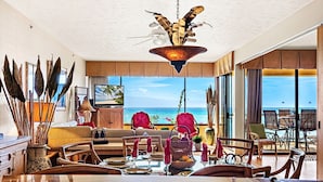 A spacious living area with a large dining table, comfortable seating, and a view of the ocean. - Extended Summer Special $250n 9/1-11/20- 2bd Oceanfront View-SK 344 Sullivan (Lahaina)