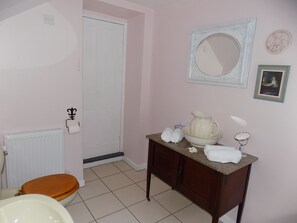Bathtub, hair dryer, towels, soap