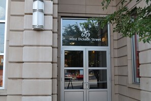A building entrance with a sign reading "609 West Dickson Street". - 6th Floor Condo in The Dickson with View of Old Main (Fayetteville)
