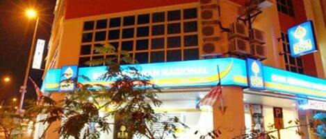 A building with a sign reading "Langit Langit" and a "Bali National Park" sign.
