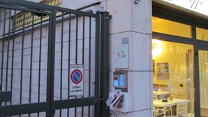 A cafe named 'Caffè Paglia' with a signboard and a no parking sign. - Alex e Angie (Bergamo)
