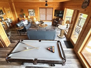 A pool table in a cabin with a sofa, chairs, and a television. - HEAVENLY DAZE — THREE KING SUITES, THREE LIVING AREAS & ROOM FOR 12 (Sevierville)