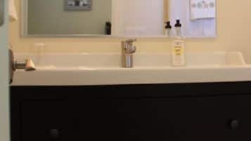 Combined shower/bathtub, hair dryer, towels, soap